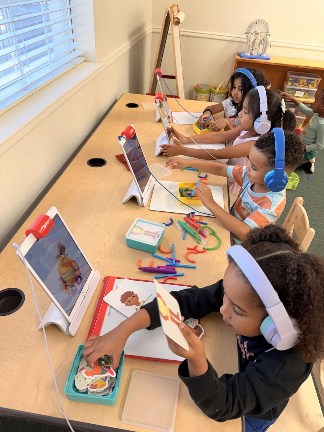 Collaborative Montessori language activity supporting social confidence in Plano TX