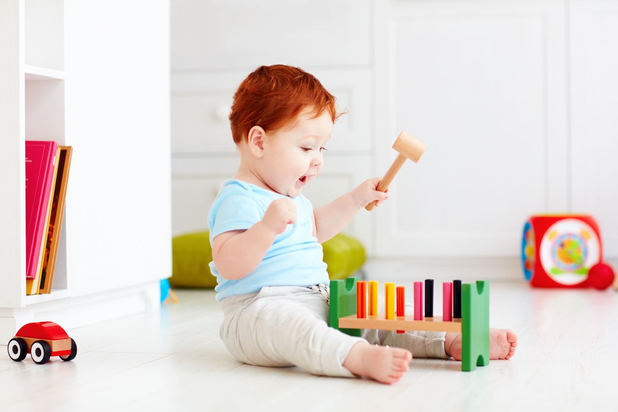 Mobile infant class exploring Montessori materials in Plano TX